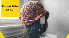 a crocheted hat sitting on top of a mannequin's head