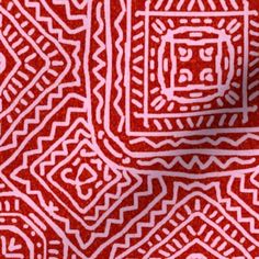 a red and white background with an intricate design on it's side, in the middle