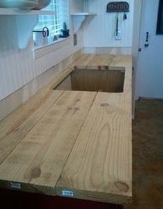 a kitchen counter made out of plywood is shown