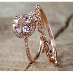 two wedding rings with diamonds on top of each other