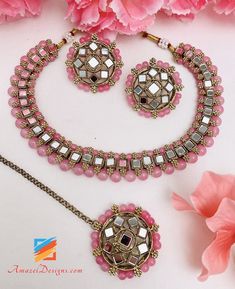 Pink Mirror Single Line Choker Necklace Studs Earrings Tikka Set Available to be shipped for FREE from Canada to USA, Europe, Italy, Norway and everywhere else. Explore more PUNJABI BRIDAL JEWELLERY SETS 👉 PUNJABI BRIDAL JEWELLERY ONLINE 🛒 INDIAN BRIDAL JEWELLERY 📦Unmatched FREE Worldwide Shipping Deepika, USA ⭐️⭐️⭐️⭐️⭐️ Thank you Thank you Thank you!! If I fell in love with the pictures, then I’m absolutely floored after seeing these bangles in person. Thank you for paying such close attenti Trendy Pink Metal Choker, Adjustable Pink Metal Choker, Pink Round Necklace For Party, Trendy Round Pink Necklaces, Trendy Pink Round Necklace, Trendy Pink Round Necklaces, Pink Metal Choker Necklace, Pink Metal Choker For Party, Bridal Jewellery Online