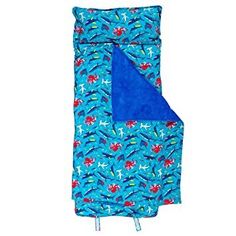 a blue sleeping bag with red and green leaves on it