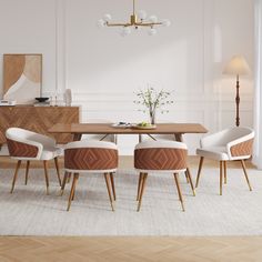 a dining room table with four chairs and a vase on the end, in front of it