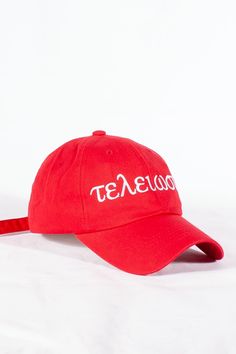 a red hat with the word texas printed on it, sitting on a white surface