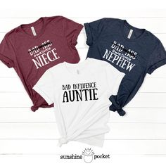 Funny shirts for that Aunt/Uncle Niece/Nephew sets! This listing is for ONE SHIRT.  - Select the size, add personalization info, click 'Add To Cart', then go back to this listing and repeat for 2nd size.  - Reference size charts carefully, keeping in mind that the sizing table only contains measurements for one side of the garment, not the circumference. Choose size(s) from drop-down menu. - Please allow 7 - 14 business days for processing and shipping. -Bella and Canvas Tees are a buttery-soft cotton/cotton blend shirt with rib-knit collars and sloped shoulders to bolster shaping. Our designs are printed with water-based, non-toxic, odorless ink. - Care Instructions Items should be washed inside out in cold water without bleach, dry cleaning, or ironing directly on the pattern. - Returns Matching Aunt And Nephew Shirts, Funny Aunt Shirts, Auntie Things, Sloped Shoulders, Nephew Shirts, Aunt And Niece, Uncle Tshirt, Aunt Shirts, Bad Influence