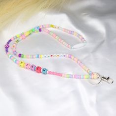 Custom name lanyard is a bead teacher lanyard. This pastel rainbow fun lanyard is special gift for teacher. It can be a badge necklace or badge holder. Colorful lanyards are the perfect addition to your summer jewelry collection. Add some pop color to any outfit when you wear this fun lanyard set. You can choose several length. Extra small: 24'' Small: 30'' Medium: 32'' Large: 34'' W H Y - Y O U ' L L - L O V E - I T ♥ * It's dainty can be worn every day * A special piece you'll treasure * High Trendy Pink Badge Holders As Gift, Fun Multicolor Lanyards As Gifts, Fun Multicolor Lanyards For Gifts, Cute Multicolor Lanyard As A Gift, Cute Multicolor Lanyards As Gift, Cute Multicolor Lanyard For Gifts, Cute Multicolor Lanyard As Gift, Trendy Multicolor Lanyards For Gifts, Trendy Multicolor Lanyards As Gifts