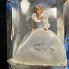 a barbie doll in a white dress and tiara with the words princess of wales on it