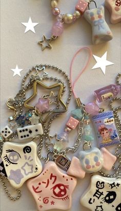 many different items are hanging on a table with star shaped objects in the background and white stars above them