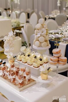 a table topped with lots of desserts and cakes