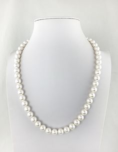 "Timeless elegance with a sleek modern twist! This strand of Mother of Pearls have a singular way of making virtually any ensemble seem just that little bit classier...a little more sophisticated. But, hang one...you don't want too much of that either. So how do you get the benefits of pearls while keeping the edginess of your carefully crafted contemporary aesthetic intact....by picking the right size, shape and color Alternative to real pearls at a quarter of the price, with the same classic e Classic Pearl Necklaces With Polished Beads, Classic Sterling Silver Pearl Necklace For Everyday, Elegant Polished Pearl Necklace For Anniversary, Classic Single Strand Beaded Necklaces, Classic Single Strand Beaded Necklace For Everyday, Minimalist Single Strand Pearl Necklace For Formal Occasions, Classic Polished Beads Jewelry For Formal Occasions, White Polished Pearl Necklace For Formal Occasions, Elegant Adjustable Sterling Silver Beaded Necklaces