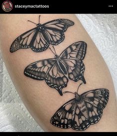 three black and white butterflies on the thigh