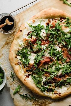 a pizza sitting on top of a wooden cutting board