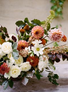 a bouquet of flowers sitting on top of a table next to an instagram page