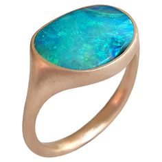 Dalben design One of a kind 18 kt rose gold satin finishing ring with a 3,93 carat bezel-set Australian Boulder Opal . The stone has deep light blue colors with green light spots. Ring size 6 3/4 - EU 54 re-sizable to most finger sizes. Bezel setting dimension: max width 15,9 mm, max height 11,1 mm. The ring has been designed and handcrafted in our atelier in Italy Como with a rigorous quality workmanship . Opal Rose Gold Ring, Italy Como, Rose Gold Opal Ring, Boulder Opal Ring, Indian Jewelry Earrings, Australian Black Opal, Lightning Ridge Opal, Vintage Cocktail Ring, Light Spots