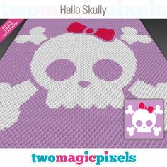 a knitted blanket with a skull and bow tie on the front, in pink