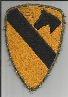 an embroidered patch with a horse on it's head and a black line in the center