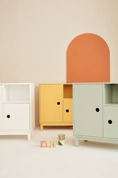 an assortment of furniture in various colors and sizes, including a cabinet with two doors