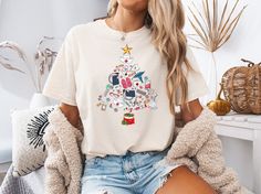 Celebrate the holiday season with our charming Nurse Christmas T-shirt, the perfect blend of festive spirit and heartfelt appreciation for those in the nursing profession. This cute Christmas shirt features an adorable design specifically crafted for RNs, featuring elements that any ICU Christmas nurse or NICU Christmas nurse would love! ️ Whether you're an ER nurse or working in the NICU, our T-shirt brings joy to the workplace and celebrates the spirit of giving and caring that defines nursing. It's not just a shirt; it's a thoughtful nurse Christmas gift that showcases your passion for your profession. Perfect for the oncology nurse, PICU nurse, or PEDS nurse, our stylish and comfortable design ensures that you shine during the holidays. 💖 Make a statement this Christmas season with ou Nurse Christmas Tree, Nicu Christmas, Peds Nurse, Oncology Nurse, Picu Nurse, Christmas Gifts For Nurses, Cute Christmas Shirt, Nursing Shirt, Nursing Profession