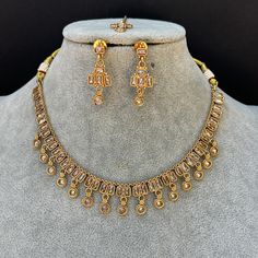 Gold Polki stone Necklace Set/Kundan Choker/Bollywood Jewelry/Indian jewelry/ Pakistani necklace/punjabi necklace/bridal /indian wedding This is 100% Handmade jewelry. So Color, shades, texture displayed may slightly vary from the actual product due to digital image limitations. We request you to consider these minor variations. Please expect the possibility of some slight imperfections when buying hand made jewelry. If you have any questions, please message or email us. Arrives in gift box. Please let me know if you have any questions. Thank you so much visiting my shop. Gold Kundan Bollywood Necklace, Gold Bollywood Kundan Necklace, Gold Jeweled Bollywood Necklace, Gold Jeweled Bollywood Temple Necklace, Bollywood Gold Jeweled Necklaces, Gold Jeweled Bollywood Bridal Necklace, Bollywood Style Jeweled Gold Necklace, Gold Jeweled Kundan Necklace Bollywood Style, Bollywood Style Gold Jeweled Kundan Necklace