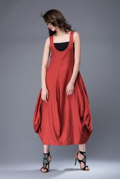 Super feminine and comfortable, this casual red linen dress is a must-have for any summer wardrobe.  Wear it with chunky boho jewelry for a casual look and relaxed vibe. You'll create an entrance wherever you go with this incredibly versatile linen dress.  Sleeveless, loose-fitting and flaunting a gorgeous tulip-shaped hemline, the dress is suitable for any shaped lady.  This is a really versatile but unique designer dress.FEATURES- 100% Linen- Sleeveless- Lower Round Neckline- No zipper-Loose f Casual Red Linen Beach Dress, Red Linen Bohemian Dress, Red Linen Dress For Spring, Red Bohemian Linen Dress, Red Lagenlook Dress, Red Linen Summer Dress, Casual Red Linen Dress, Red Lagenlook Summer Dress, Red Linen Maxi Dress For Summer