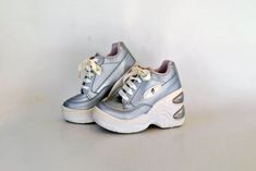 NEW! Silver Sneaker platforms! color is silver, LOGO in tongue and side 90'S Club Generation! Giant sole platforms, Platform searchers are gonna love it <3 Sole is about 10+ cm ( 3.9 inches) high in the back and 5 cm (1.9 inches) in the front side of the shoe that means that you add 5 cm in your original height ;) INSOLE MEASURE APPROX 22.5 CM / 8.8 INCHES Condition :  New / Unworn Brand : G MADE IN CEE Size Chart: UK SizeEU SizeUS Size 3                36       5 Please, read our shop policies Silver Platform Sneakers With Round Toe, Shoes 90s, Silver Platforms, Silver Sneakers, Cosplay Shoes, Shoes Vintage, Shoes Trainers, Platform Boots, Vintage Shoes