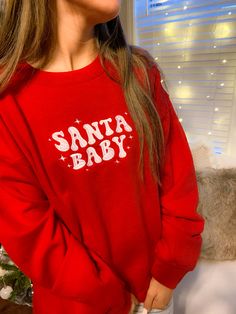 Get festive with our Santa Baby Crewneck Sweatshirt! The Unisex Sizing makes the sweatshirt run slightly larger than your average sweatshirt for women. Most men find their normal size to be more snug. If you want a slightly looser fit, size up one size. Please check out our size chart for measurements to ensure an accurate fit. PLEASE BE SURE TO INPUT YOUR CORRECT SIZE/COLOR + SHIPPING ADDRESS. We will not be responsible if it is incorrect! Refunds/Exchanges accepted, please read our Refund Poli Cute Christmas Sweater, Christmas Fits, Xmas Jumpers, Baby Red, Preppy Christmas, Red Crewneck, Holiday Sweatshirt, Holiday Style, Santa Baby