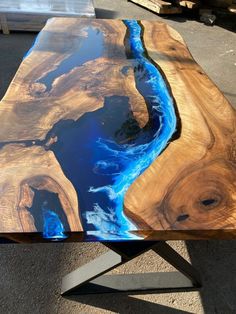 a wooden table with blue paint on it