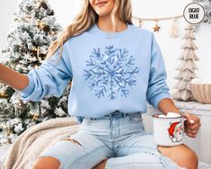 This blue toile inspired snowflake sweatshirt is the perfectly cozy crewneck to throw on during all of your holiday festivities or while relaxing at home.  Treat yourself, or make this a gift for the person in your life who loves the winter the most. PLEASE READ THROUGH ALL OF THE FOLLOWING INFORMATION.  IF YOU HAVE FURTHER QUESTIONS, WE ARE HAPPY TO HELP! Welcome to CuratedClothCo.!  Here you can find the perfect, trendy attire whether you are gifting for someone else or yourself.  We strive to provide quality merchandise and quick customer service in order to make your buying process fun and easy.  We hope you love our designs as much as we do! FREE SHIPPING ON ALL ORDERS SHIPPED WITHIN THE U.S.!! *Orders typically arrive 7-14 days after purchase, although they many arrive sooner. *Produ Snowflake Sweatshirt, Watercolor Snowflake, Screen Printing Techniques, Snowflake Sweater, Blue Toile, Buying Process, Orders Shipped, Sweatshirt Christmas, Winter Gift