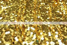 gold sequinized fabric with the words prestige linens on it