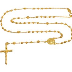 Make a striking statement with the exquisite 18k gold-filled Virgin Rosary Necklace. Inspired by faith, prayer, and protection, its design resonates with symbolism. Whether worn solo for an elegant aura or layered with other pieces for a personalized touch, this necklace elevates any ensemble. Ideal for daily wear or special events, it's a must-have accessory for those who wish to showcase their faith with flair. -18K Gold Filled -Miraculous Virgin Rosary Necklace. -Width: 1.5 mm -Beads: 3mm. -A Gold Plated Crucifix Jewelry With Adjustable Chain, Gold Plated Crucifix Necklace Tarnish Resistant, Gold Plated Tarnish Resistant Crucifix Necklace, Spiritual Crucifix Clavicle Chain Jewelry, Gold-plated Tarnish-resistant Crucifix Necklace, Spiritual Gold Plated Cross Pendant Necklace, Gold Plated Cross Pendant Necklace With Spiritual Style, Gold Plated Cross Pendant Necklace Spiritual Style, Spiritual Cross Necklace In Yellow Gold