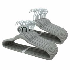 three rows of clothes hangers on a white background