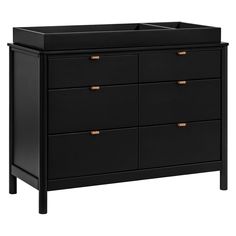 a black dresser with gold handles and drawers