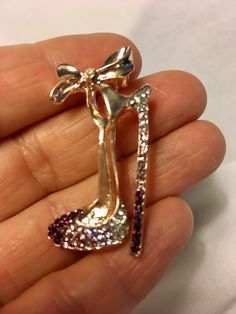 "This High Heel Shoe Brooch Pin, 50th Birthday Decor, 40th Birthday Decor, Paris Sweet 16 Theme, Paris 50th Birthday, Paris Decorations, Bridal Shower Gifts, Bridesmaid Gifts, 30th Birthday favors, High Heel Theme Birthday, High Heel Pin, High Heel Brooch, Rhinestone high Heel Brooch, Rhinestone High Heel Pin. This stunning Rhinestone Pin will dazzle your event. Great given as a gift, added to centerpieces, hats, coat, or outfit. This would be a stunning bridesmaid gift, or favor for a special b Glamorous Silver Brooch For Party, Glamorous Silver Brooches For Party, Glamorous Bling Brooches As A Gift, Glamorous Bling Brooches As Gift, Gold Glamorous Party Brooches, Gold Party Brooches With Bling, Glamorous Gold Party Brooches, Glamorous Rhinestones Brooches For Party, Glamorous Silver Party Brooch