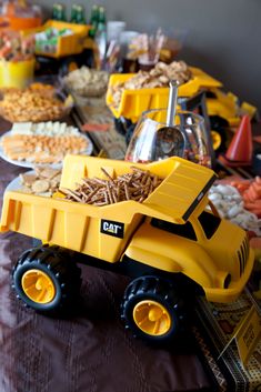 a table filled with lots of food and toys