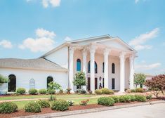 a large white house with columns on the front