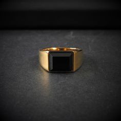 A classic ring that is perfect for daily use, since it is versatile and easy to combine with any outfit. It is made of stainless steel and 18k gold plated, which will make it resistant to water, sweat... whatever, plus it will maintain its quality and color over time. Gold And Onyx Ring Men, Black 14k Gold Signet Ring With Polished Finish, Mens Gold Onyx Ring, Black Cabochon 14k Gold Rings, Luxury Men's Yellow Gold Onyx Ring, Black Gems, Stainless Steal, Gem Ring, Pendant Rings