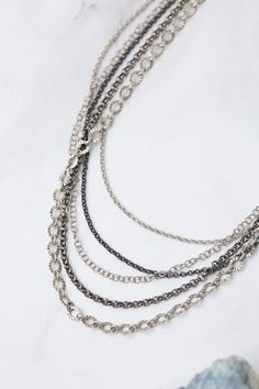 Experience the beauty and versatility of the Reflections Collection. Each piece is thoughtfully handcrafted using carefully chosen materials. This multistrand necklace measures 16.5-18.5" and is completed an antique silver plated brass extender chain and lobster claw clasp. Elevate your style with Reflections. Antique Silver Plated Brass (lead and nickel free) Mixed Metal 16.5-18.5", adjustable with antique silver plated brass lobster claw clasp We hand select our natural materials, thus there m Floyd Va, Lobster Claws, Multi Strand Necklace, Mixed Metals, Multi Strand, Elevate Your Style, Designer Jewelry, Natural Materials, Lobster Claw