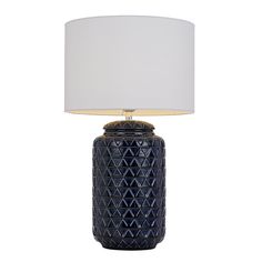 a blue table lamp with a white shade