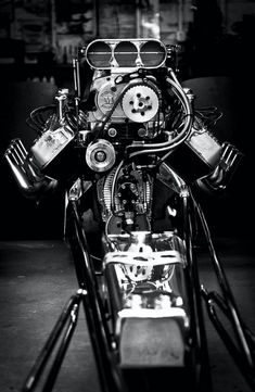 a motorcycle engine is shown in this black and white photo with glasses on it's head