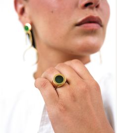 An update of an iconic style, our gold-plated Petra Circle Signet Ring surprises and delights with a beautiful green agate semi-precious stone. Worn alone or with a stack of rings, Petra always stands out. Crafted from a layer of gold over Italian brass, the Petra Circle Signet Ring is shaped and polished by hand. Pair Petra with a matching manicure to really make her pop. Details Everything you need to know. Measures 1.5 cm on it's face. Sizes 5-9 Handcrafted from semi-precious stones and gold Modern Yellow Gold Jade Jewelry, Yellow Gold Agate Ring, Modern Jade Ring As A Gift, Gold Plated Green Rings For Gift, Green Gold Plated Rings For Gift, Green Gold Plated Ring, Green Gold-plated Ring, Modern Gold Emerald Ring For Everyday, Green Gemstone Ring Gold-plated