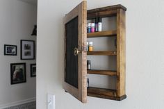 "FREE SHIPPING in the USA This essential oil cabinet has 4 shelves and can hold over 100 5 ml bottles. The door painted in a chalkboard paint, allows you to store your oils in the dark. The shelf has a magnetic closure to keep the door securely closed. The est shelf dimensions are 18\" x 13\" x 4\" This is a wall hung shelf. This cabinet shelf does not typically come with a back panel unless otherwise requested by customer. We also have several other color finishes to choose from in our ETSY sho Essential Oil Shelf, Essential Oil Holder, Cabinet Wood, Essential Oil Storage, Storage Wall, Oil Storage, Wood Cabinet, Chalkboard Paint, Beard Oil