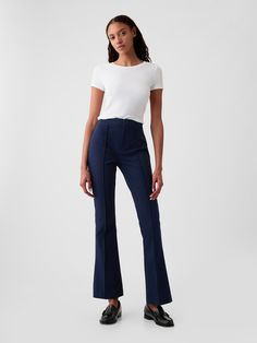 Soft cotton-spandex stretchy dress pants.  Snap button closure, zip fly.  Pintuck pleat at front.  Back welt pockets.  Our High Rise Jean has an 11" 28 cm) rise. ​ Slim through the hip and thigh, flares from knee to leg opening.  Model is approx.  5’10” wearing Best Work Pants, Preppy Business Casual, Stretchy Dress Pants, Dress Pants Outfits, Buisness Casual, Work Pants Women, Elegant Pant, Navy Blue Pants, Stretchy Pants