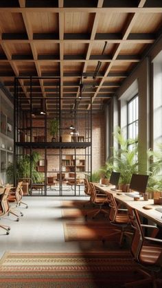 an empty office with lots of desks and chairs in front of large windows that look out onto the outdoors