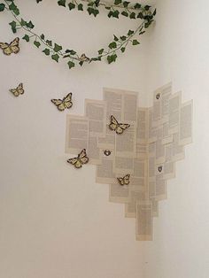 an open book with butterflies on the pages