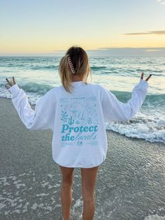 Embrace ocean-inspired style with our Protect The Locals Manatee Shirt, a tribute to marine life and coastal conservation. This isn't just any shirt--it's a symbol of respect for our ocean friends and the environment. With its playful design and vibes, it's perfect for those who love beachy inspired shirts. Channel the laid-back charm of coconut girl style and add a touch of beachy vibes to your wardrobe. Click now to add it to your cart and show your love for the ocean in style! 🫧 SIZING * Uni Beach Season Sweatshirt With Letter Print, Beach Season Long Sleeve Sweatshirt, Beach Long Sleeve Sweatshirt, Long Sleeve Sweatshirt For Beach Season, Summer Beach Long Sleeve Sweatshirt, White Sweatshirt For Beach Season Vacation, Casual Beach Season Sweatshirt, Casual Beach Sweatshirt, Long Sleeve Letter Print Beach Top