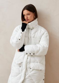 White longline puffer coat Wonder what’s like wearing a duvet? Cut with oversized proportions, the Colorado puffer coat is made from white nylon shell padded with alternative down so that it’s soft and warm to the max. Keep cozy from head to toe when you wear it fully done up – a functional built-in scarf is the cherry on top. White Long Puffer Jacket, Oversized Winter White Puffer Outerwear, White Cotton Puffer Outerwear, Winter White Puffer Jacket With Double-lined Hood, Navy Vest, White Nylon Puffer Jacket With Double-lined Hood, Grey Jumpsuit, Tan Shoulder Bag, Vegan Boots