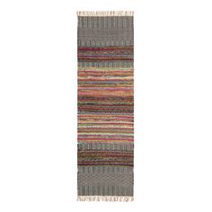 a multicolored striped rug with fringes on the bottom and one long, narrow section