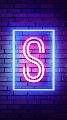 a neon sign that says s on a brick wall