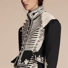 A deftly crafted wool Burberry coat cut for an authentic military-style silhouette and adorned with over 100 metres of English-woven regalia and decorative domed buttons. Cut to precision, it is adapted with a corset-inspired cut-out peplum waist while sleeves are puffed for pronounced shoulders. Royalty Fashion Men, Military Coats, Prince Coat, Royalty Fashion, Space Fashion, Burberry Coat, Military Coat