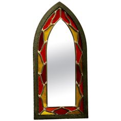 a stained glass window with a mirror in it